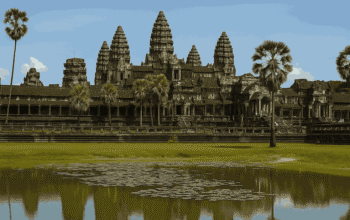 A high-resolution photo showcasing the ancient Angkor Wat temple complex in Cambodia during golden hour, ideal for travel blogs on the best places to visit in Cambodia.